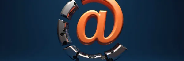 Orange 3D at sign with outer ring fragmenting to reveal hidden machinery on deep blue background