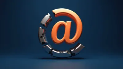 Orange 3D at sign with outer ring fragmenting to reveal hidden machinery on deep blue background