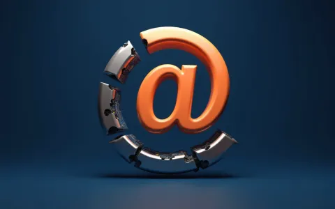 Orange 3D at sign with outer ring fragmenting to reveal hidden machinery on deep blue background
